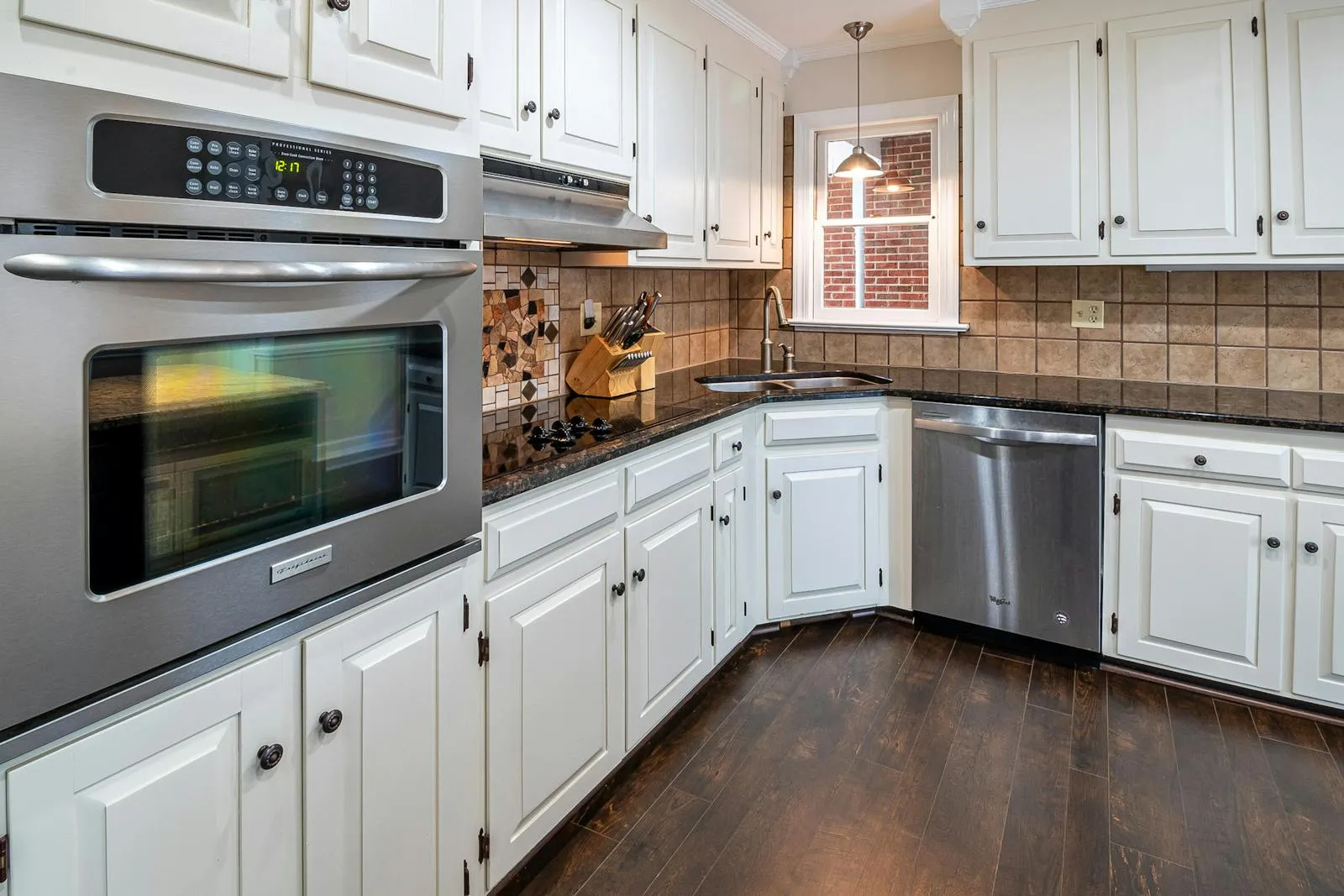Modern kitchen with painted cabinets and a wood-tone island, the kind of project Ontario homeowners typically budget for in 2026
